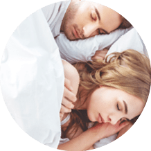 top view of young couple sleeping in bed in bedroom