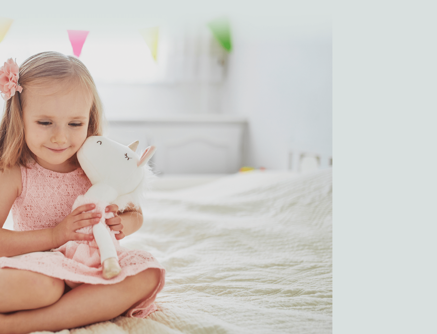 Adorable little girl in pink dress playing with unicorn  Kid having fun with soft toy  Child playing with stuffed toy