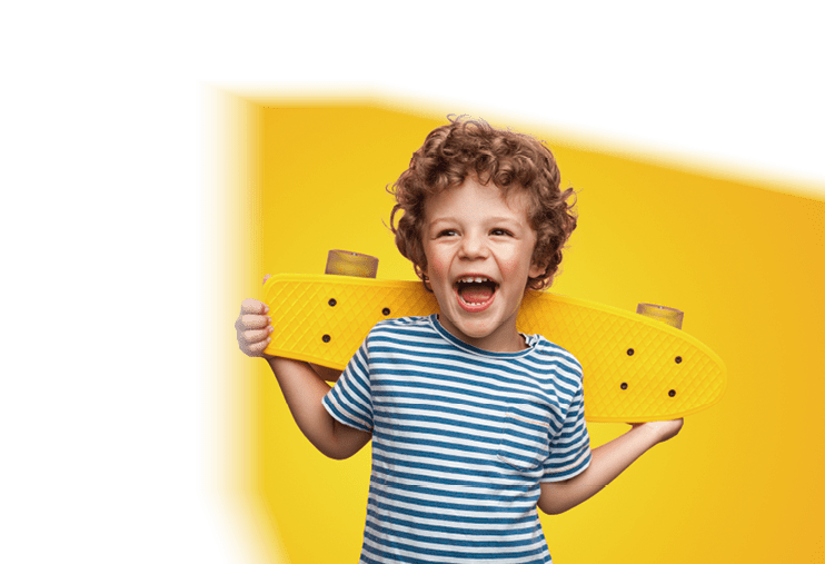 Funny happy kid in casual t-shirt holding longboard on shoulders looking super excited 