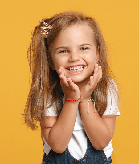Little cute child kid baby girl 4-5 years old wearing light denim clothes isolated on pastel yellow wall background, children studio portrait  Mother's Day, love family, parenthood childhood concept