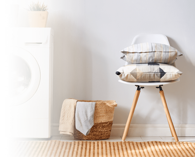 Interior of a real laundry room with a washing machine at home