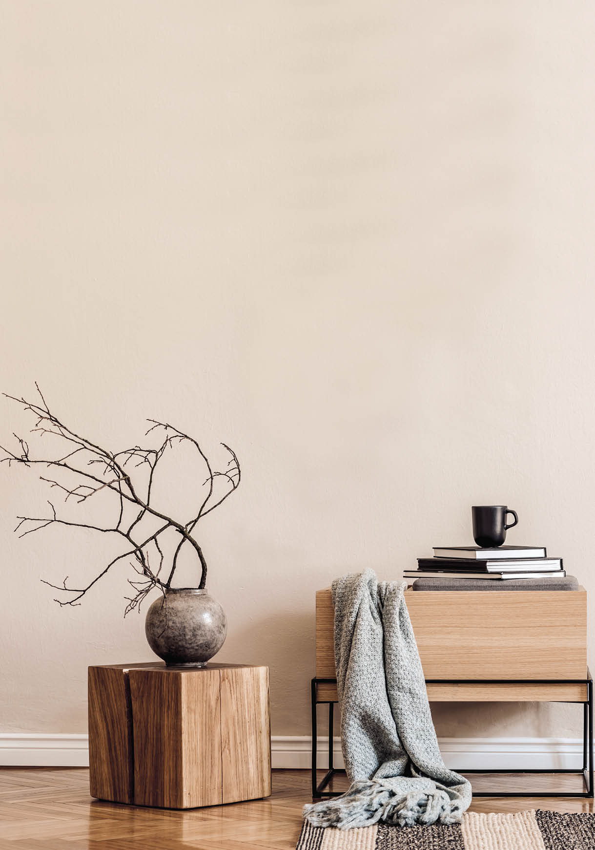 Japandi living room interior with mock up poster frame, design wooden commode, furniture, decoration and elegant accessories. Template. Stylish concept of home decor.