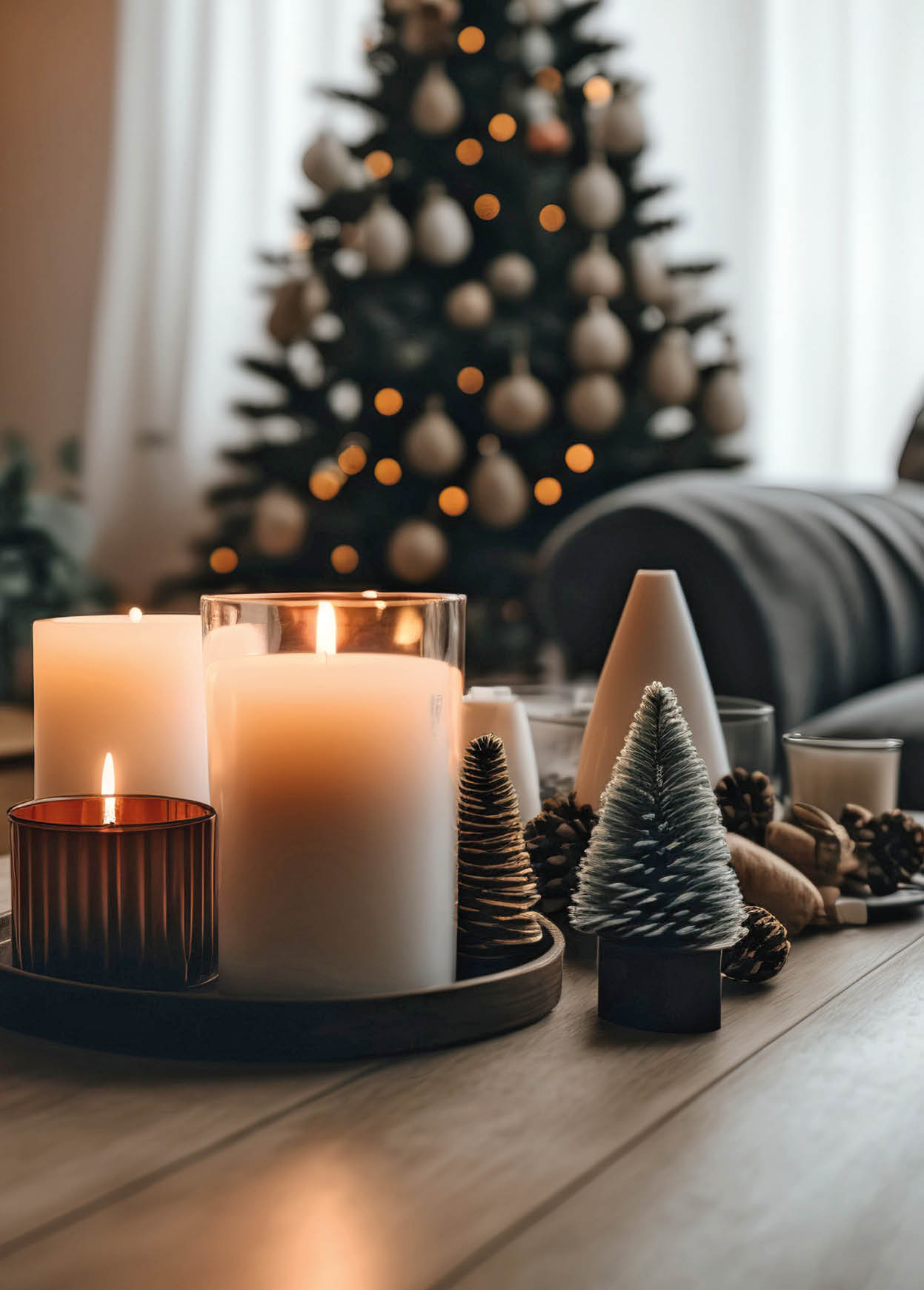 Empty wooden tabletop with candles in living room with Christmas tree. Xmas cozy holiday at home interior. Generative AI