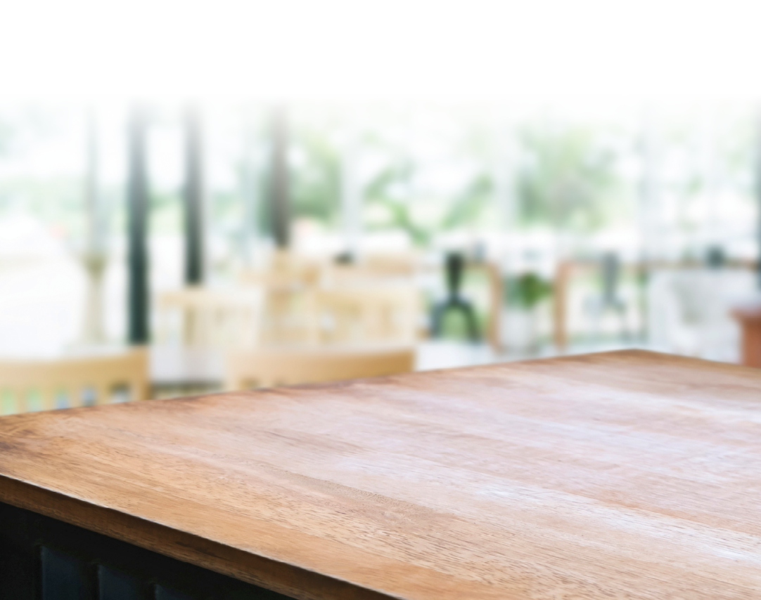 wooden table with blurred modern home background.