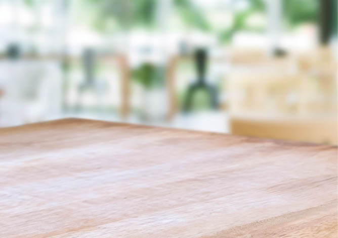 wooden table with blurred modern home background.