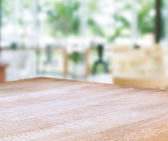 wooden table with blurred modern home background.