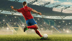 Professional soccer player with a ball in action. Soccer stadium with tribunes and fans cheering. Sports event