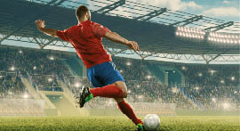 Professional soccer player with a ball in action. Soccer stadium with tribunes and fans cheering. Sports event