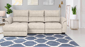 Real photo of bright living room interior with royal blue couch, three simple paintings, window with curtains and fresh plants