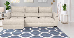 Real photo of bright living room interior with royal blue couch, three simple paintings, window with curtains and fresh plants