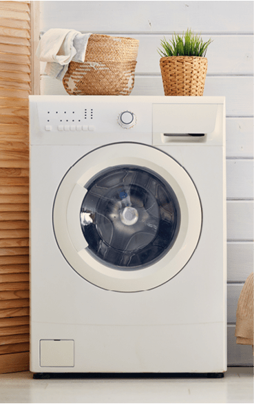 Interior of a real laundry room with a washing machine at home