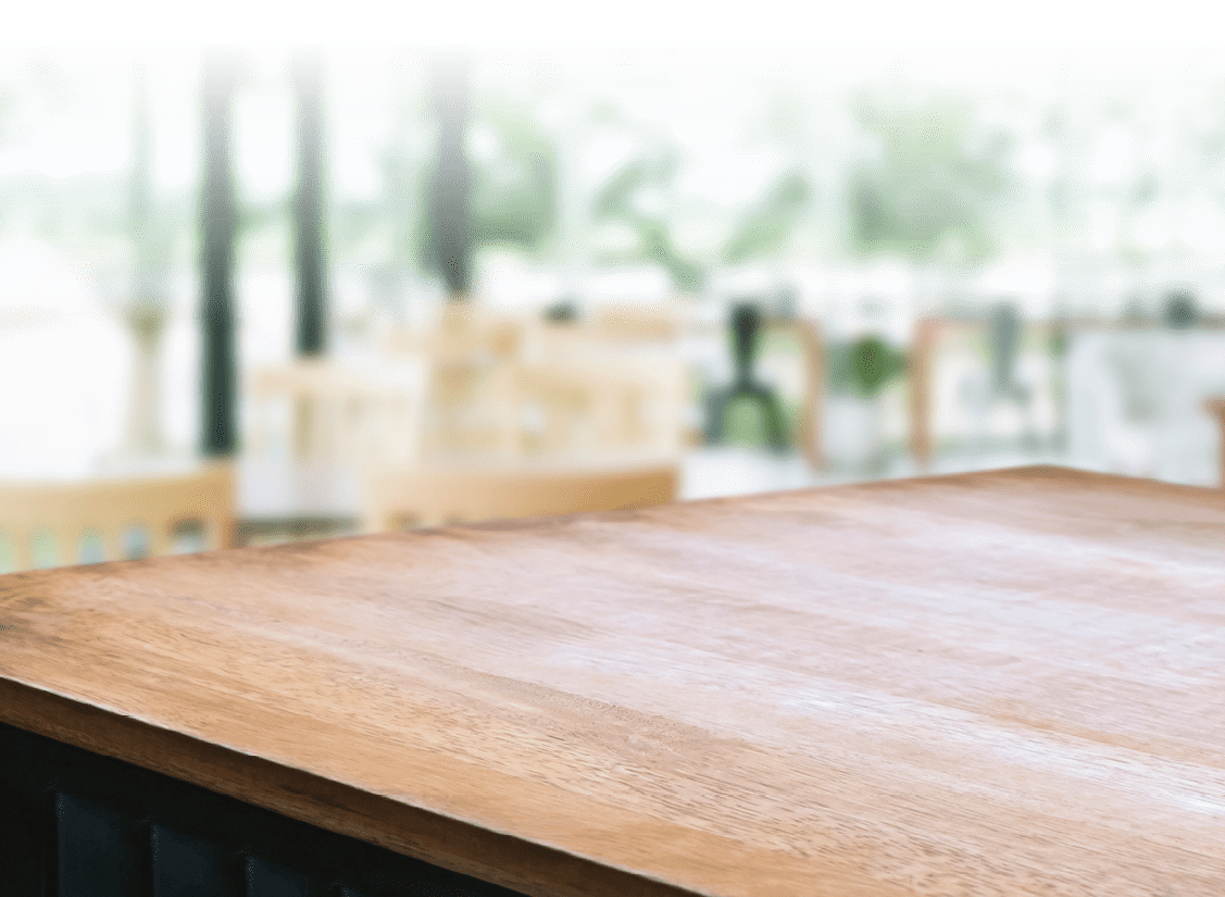 wooden table with blurred modern home background.