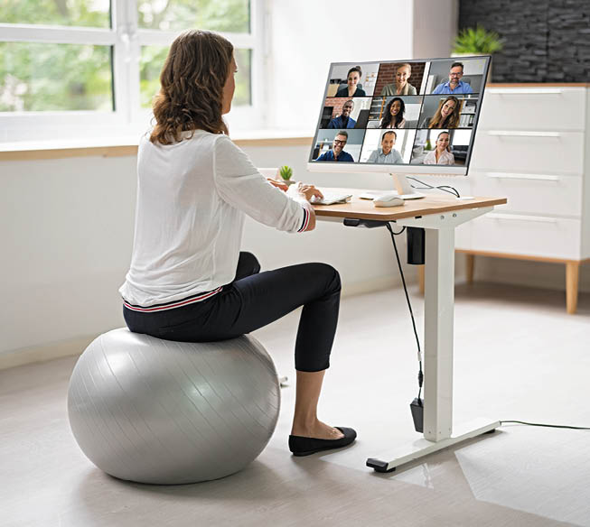 Correct Posture At Desk In Office Using Fitness Ball