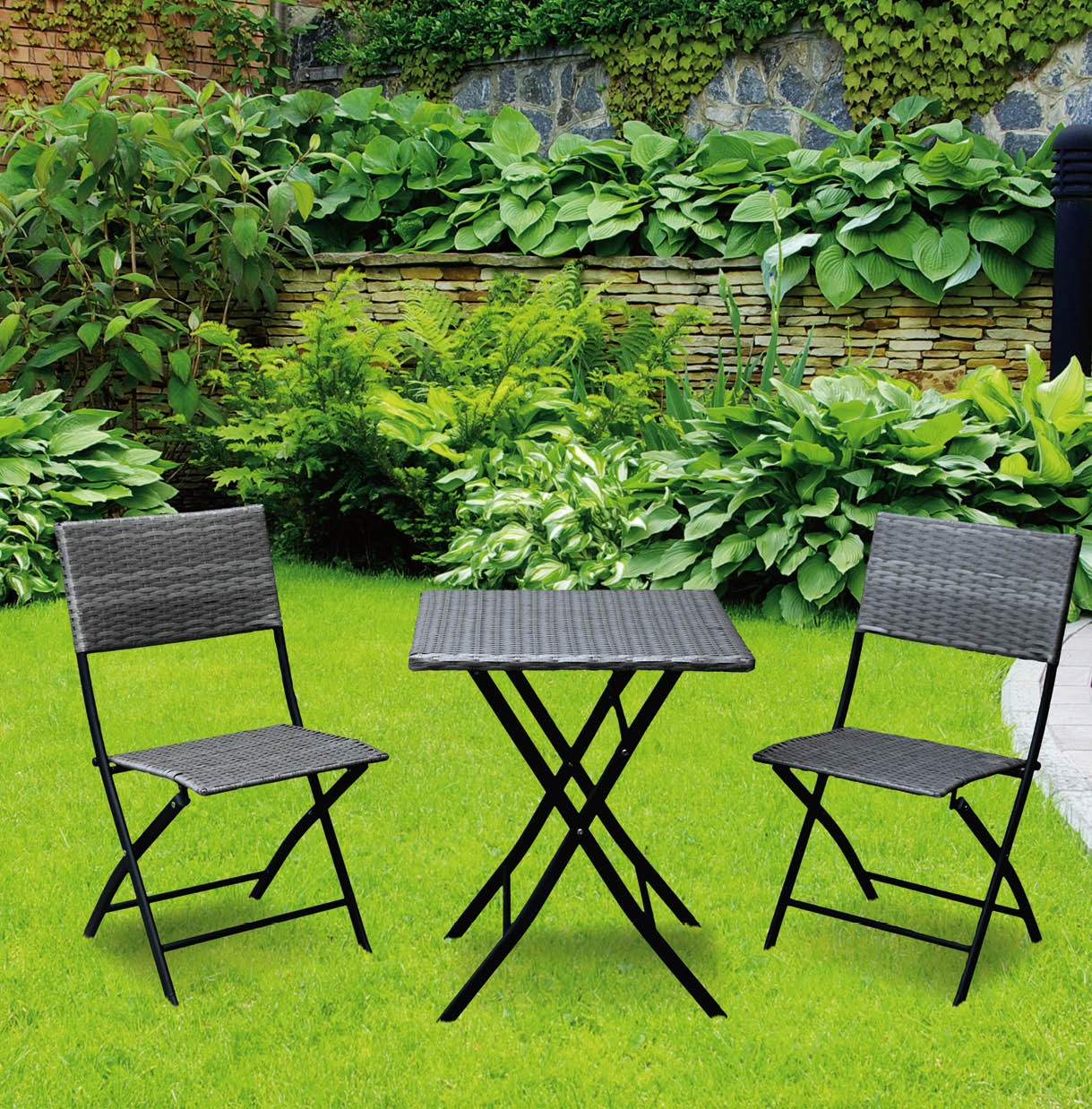 Garden stone path with grass growing up between the stones.Detail of a botanical garden.