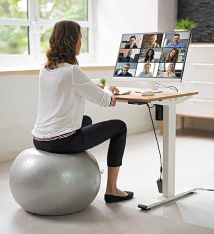 Correct Posture At Desk In Office Using Fitness Ball