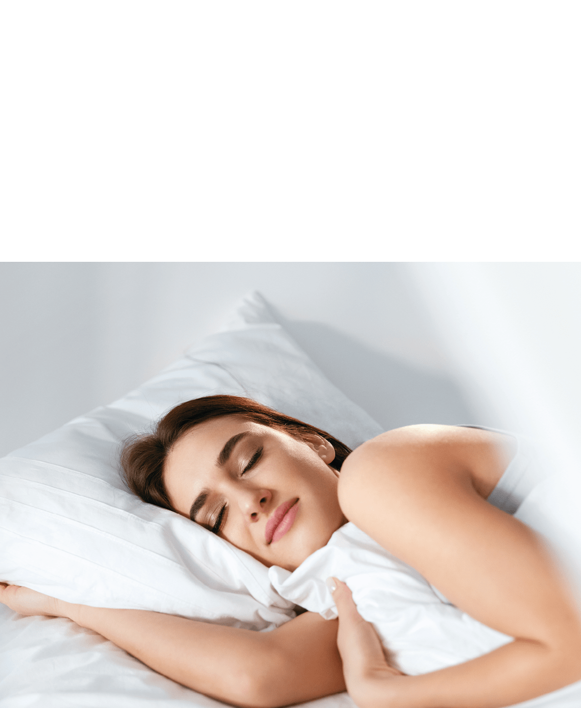 Sleep. Young Woman Sleeping In Bed. Portrait Of Beautiful Female Resting On Comfortable Bed With Pillows In White Bedding In Light Bedroom In Morning. People Sleep. High Quality Image.