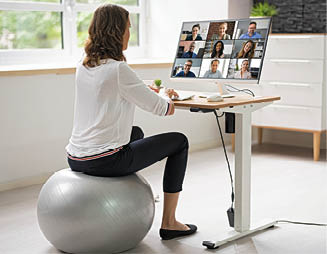 Correct Posture At Desk In Office Using Fitness Ball