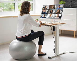 Correct Posture At Desk In Office Using Fitness Ball