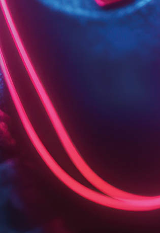 Neon gamepad on futuristic circuit board.