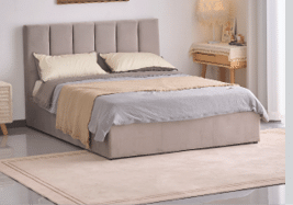 A bedroom with a white bed and a blue blanket. A teddy bear is on the floor. A book is on the nightstand. AI generated content