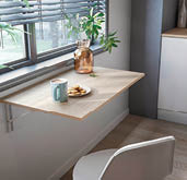 A kitchen with a window, a table, a chair, a potted plant, and a vase. AI generated content