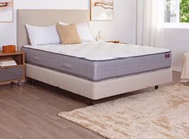 A bed with a white mattress and a red logo on the headboard. AI generated content