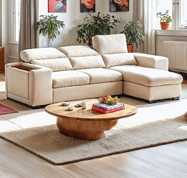 A living room with a blue couch, a coffee table, and a mirror. The room is decorated with a rug, a potted plant, and a bowl. AI generated content
