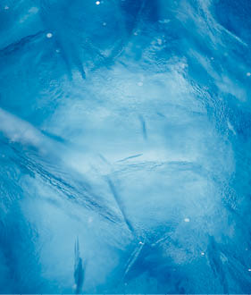 A blue and white image of a frozen waterfall. AI generated content