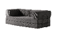 A black leather couch with a nude figure on it. AI generated content