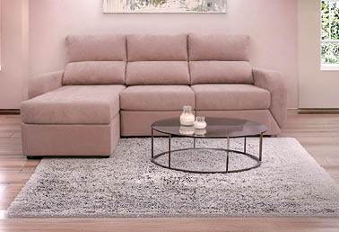 A large couch with a painting above it. AI generated content