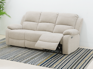 A grey couch is placed in a living room. AI generated content