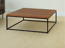 A wooden coffee table with a black frame is placed in a living room. AI generated content