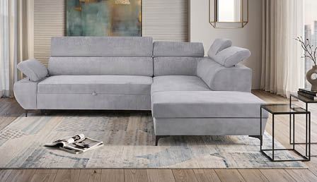 A modern living room with a white couch, chair, and ottoman. A large window provides a view of the city. A painting hangs on the wall, and a bookshelf is filled with books. AI generated content