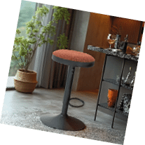 A black stool with a brown cushion on top is placed in a room with a window and a potted plant. AI generated content