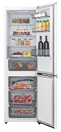 A white refrigerator with a variety of food and drinks inside. AI generated content