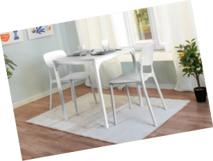 A dining room with a white table and chairs. A potted plant and a vase are also present in the room. AI generated content