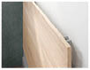 A wooden shelf is placed on a green wall. AI generated content