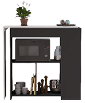A microwave is placed on a shelf with other kitchen items. AI generated content