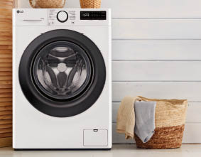 Interior of a real laundry room with a washing machine at home