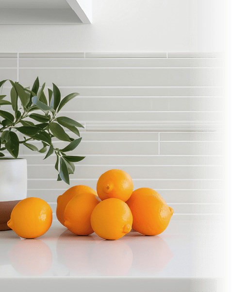 A kitchen counter with a bowl of lemons and oranges. AI generated content