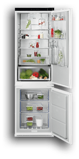 A refrigerator with a variety of food items inside, including fruits and vegetables. Conte do gerado por IA