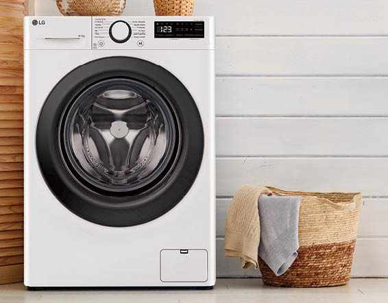 Interior of a real laundry room with a washing machine at home