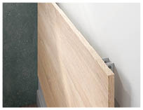 A wooden shelf is placed on a green wall. AI generated content