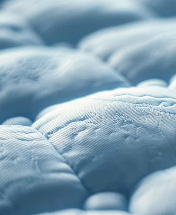 A hypoallergenic mattress pad labeled for allergy relief.