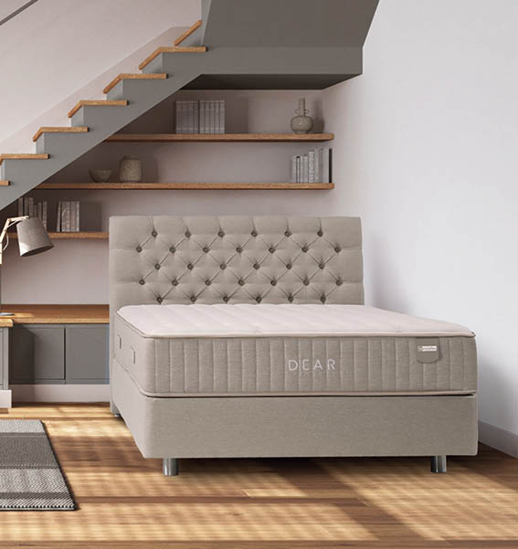 Wooden bedroom in white and gray tones. Bed with duvet and pillows, shelves, minimal staircase and panoramic windows. Parquet, scandinavian interior design