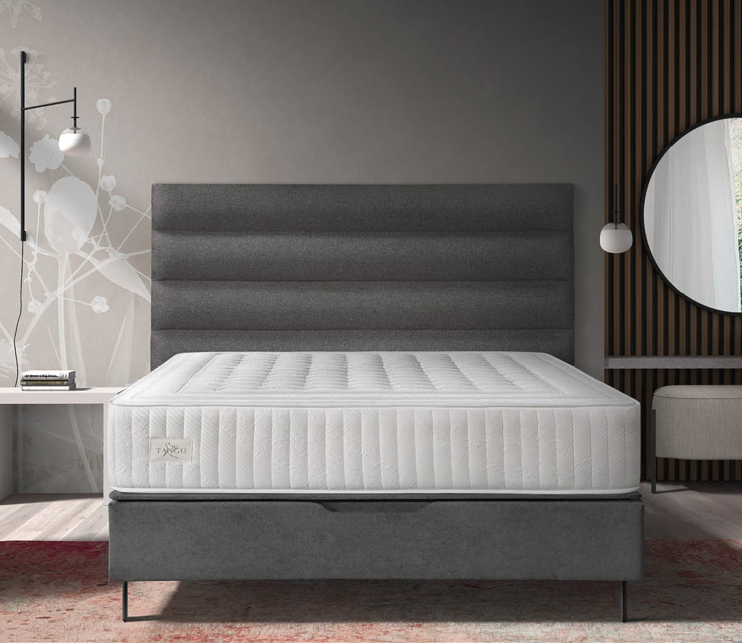 A bed with a mattress and pillows is shown in a bedroom. AI generated content