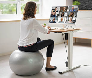 Correct Posture At Desk In Office Using Fitness Ball