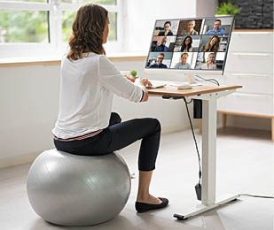 Correct Posture At Desk In Office Using Fitness Ball