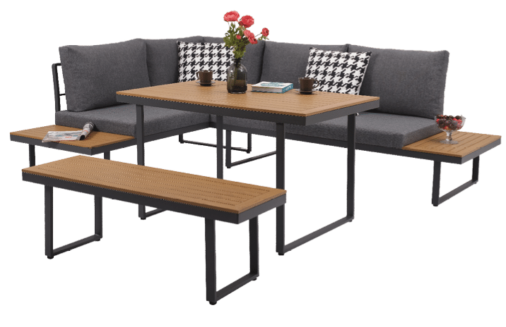 A grey couch with a checkered pillow and a vase of red flowers on a table. AI generated content