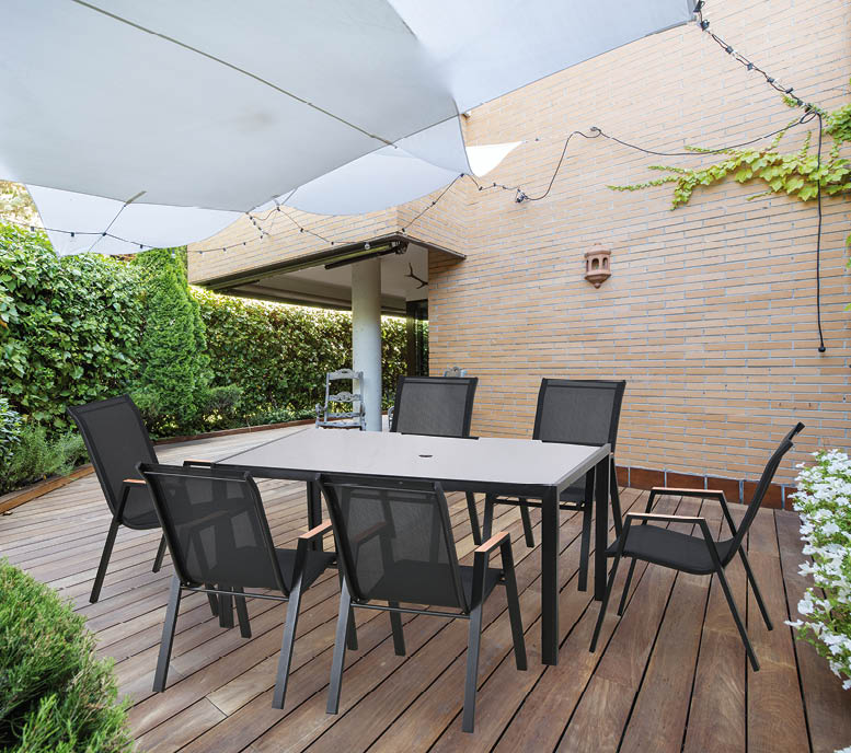 A patio table with chairs is set up outside. AI generated content